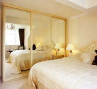 Arched mirror sliding doors