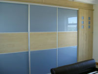 Blue coloured glass sliding doors.